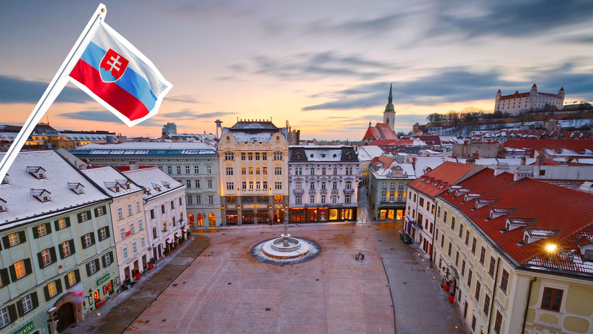 Die Slowakische Flagge vor einer Stadtansicht