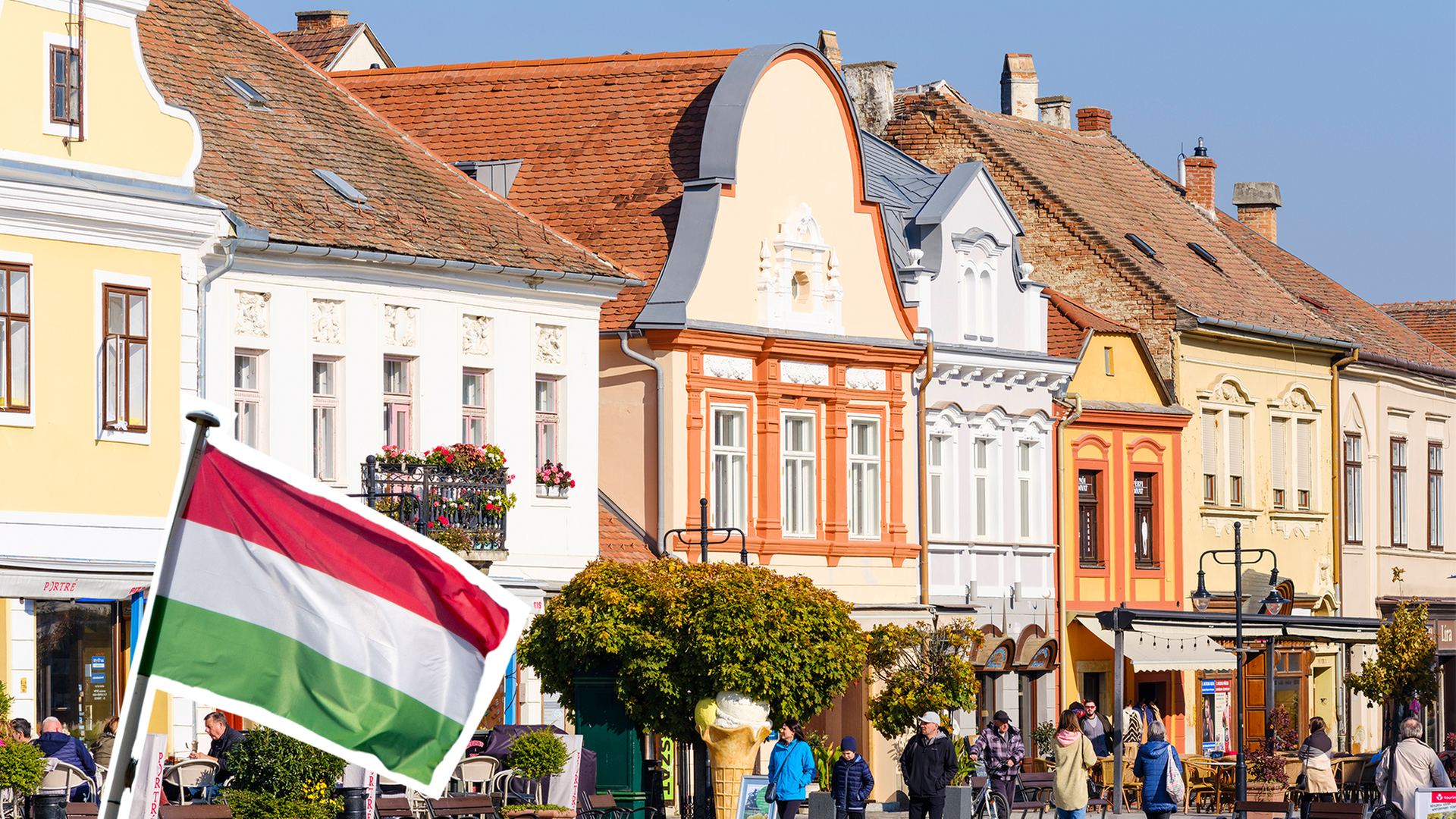 Ungarns Flagge vor einer Stadtansicht