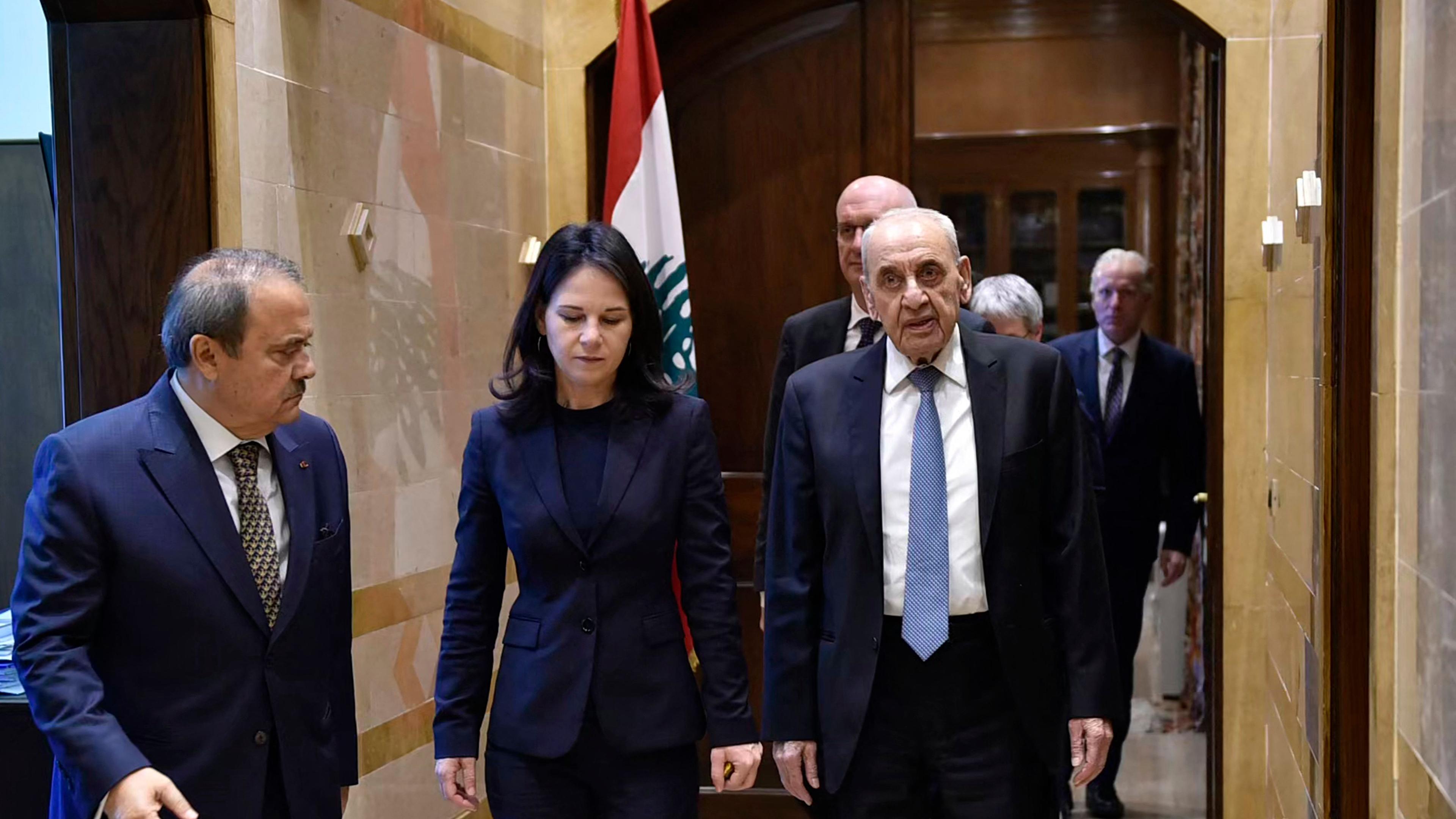 Lebanon's Parliament Speaker Nabih Berri (R) receives Germany's Foreign Minister Annalena Baerbock (C) at his office in Beirut