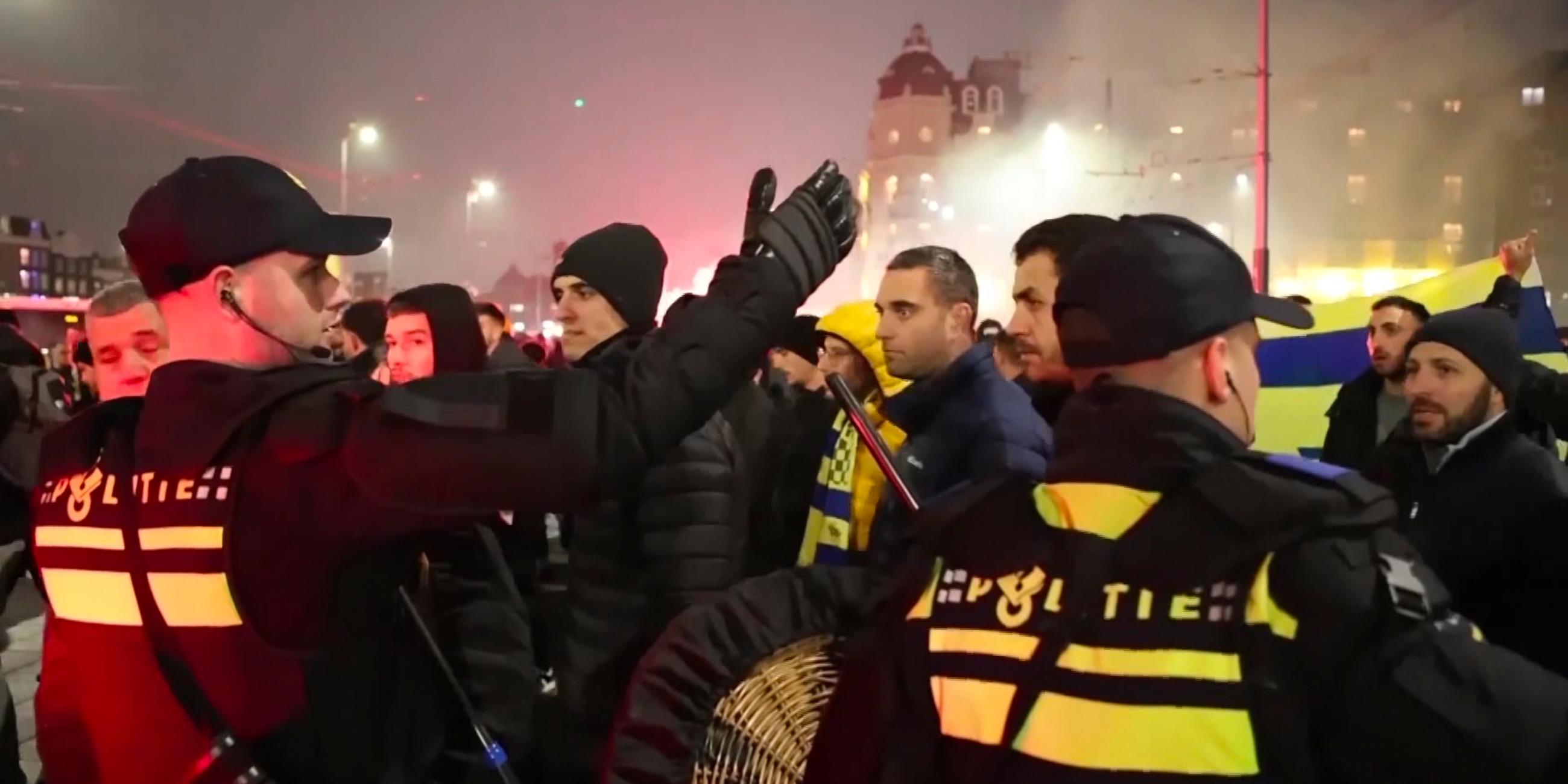 n this image taken from video, police escort Maccabi Tel Aviv supporters to the metro station leading them to the Ajax stadium, after pro-Palestinian supporters marched near the stadium, in Amsterdam, the Netherlands