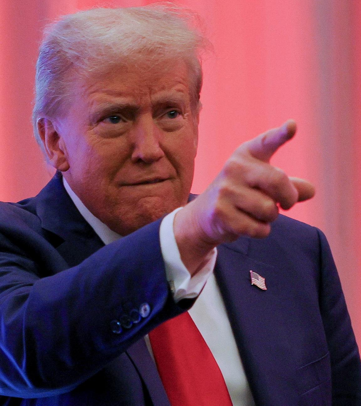 U.S. President-elect Donald Trump gestures as he meets with House Republicans on Capitol Hill in Washington, U.S., November 13, 2024