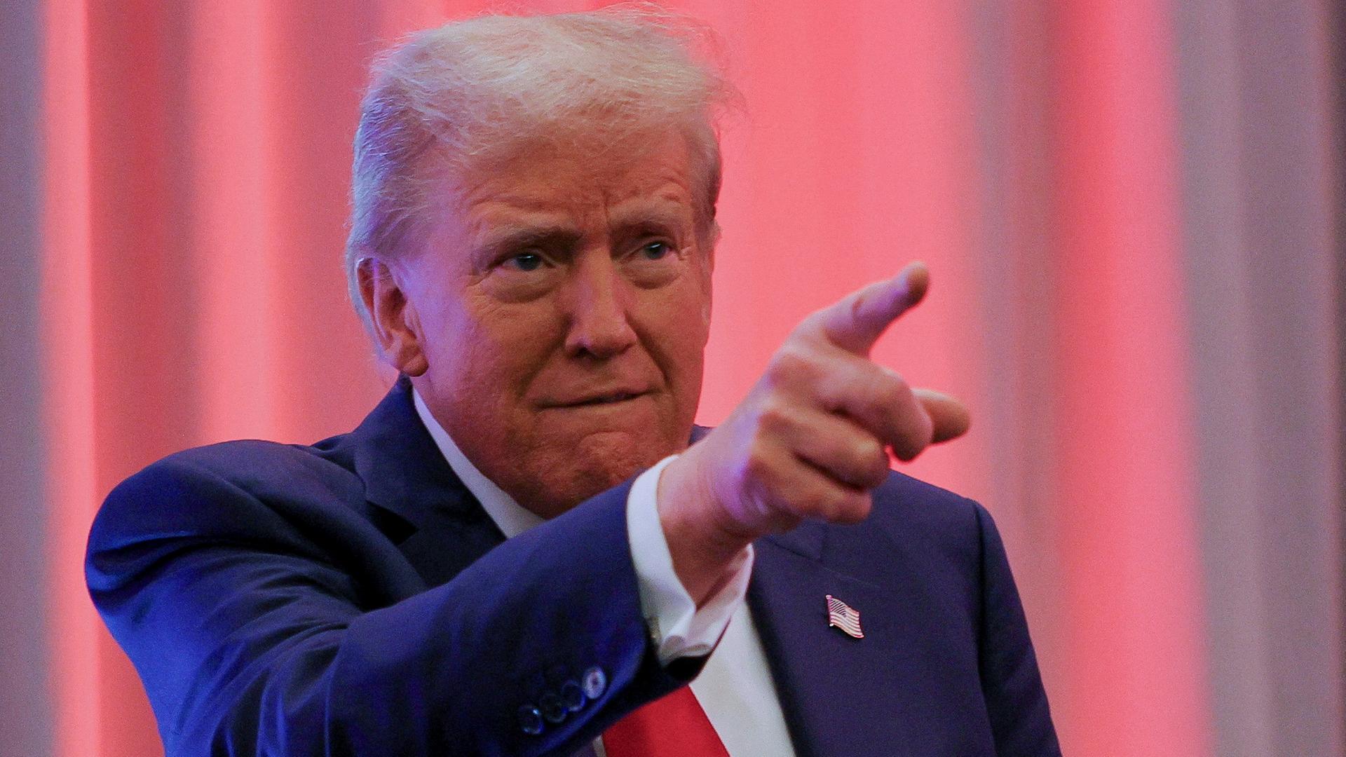 U.S. President-elect Donald Trump gestures as he meets with House Republicans on Capitol Hill in Washington, U.S., November 13, 2024