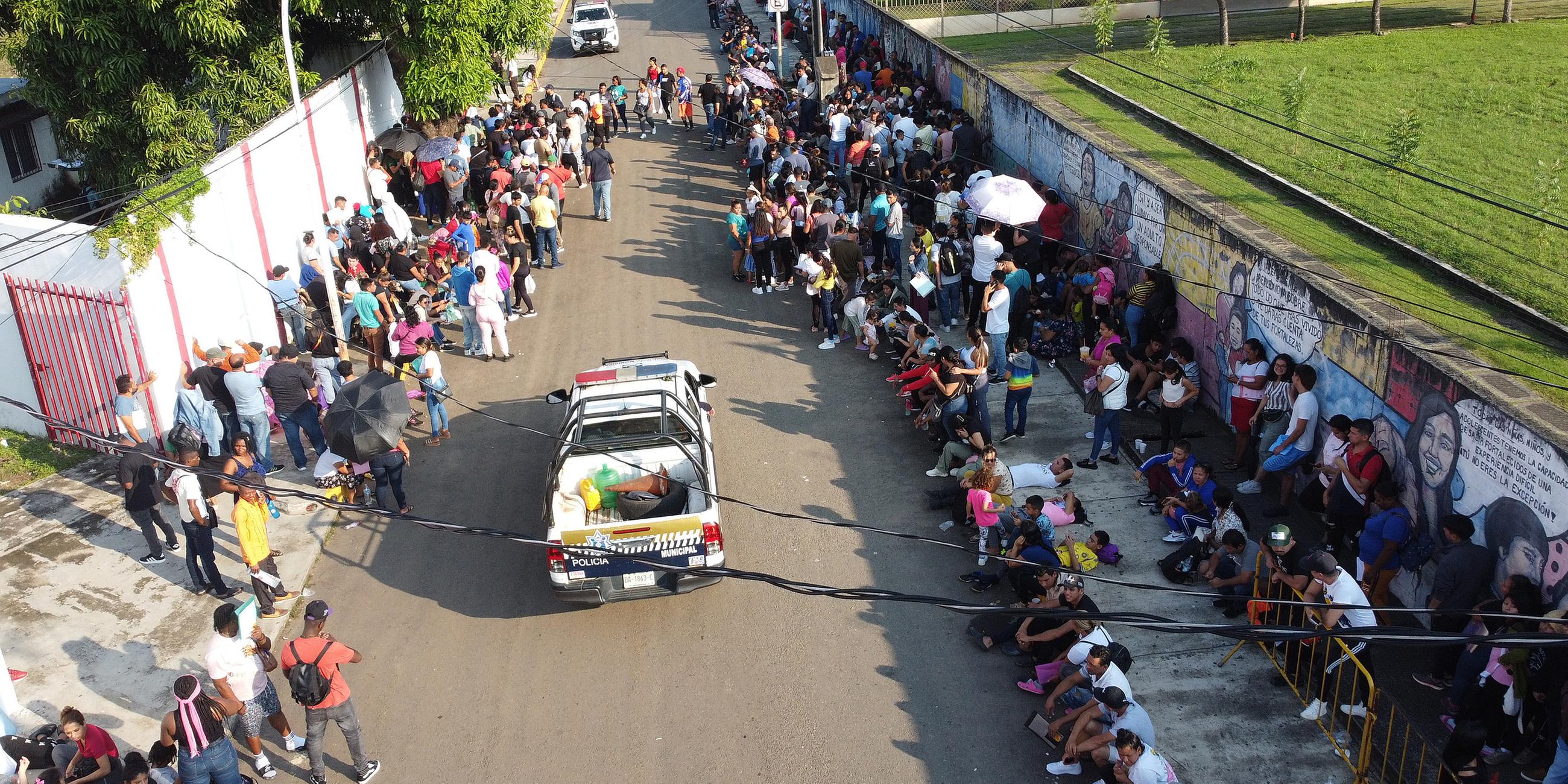 Migrants wait at Mexico's southern border after Trump's new migration measures