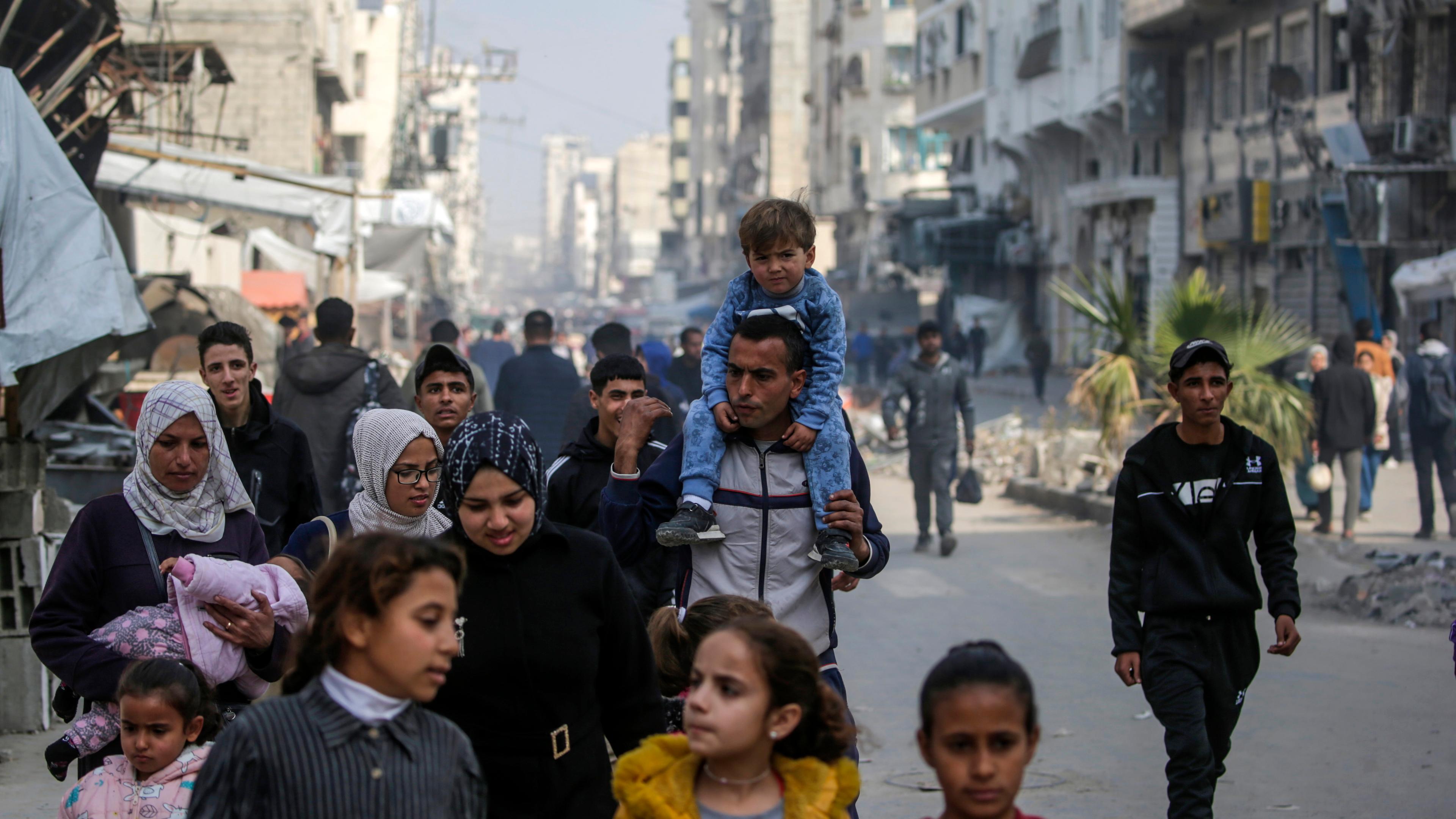  Palestinians walk in the streets of Gaza City amid a ceasefire between Israel and Hamas, Gaza Strip, 28 January 2025. Israel and Hamas implemented the first phase of a hostage release and ceasefire deal on 19 January 2025. More than 46,000 Palestinians have been killed in the Gaza Strip, according to the Palestinian Ministry of Health, since Israel launched a military campaign in the strip in response to a cross-border attack led by the Palestinian militant group Hamas on 07 October 2023, in which about 1,200 Israelis were killed and more than 250 taken hostage