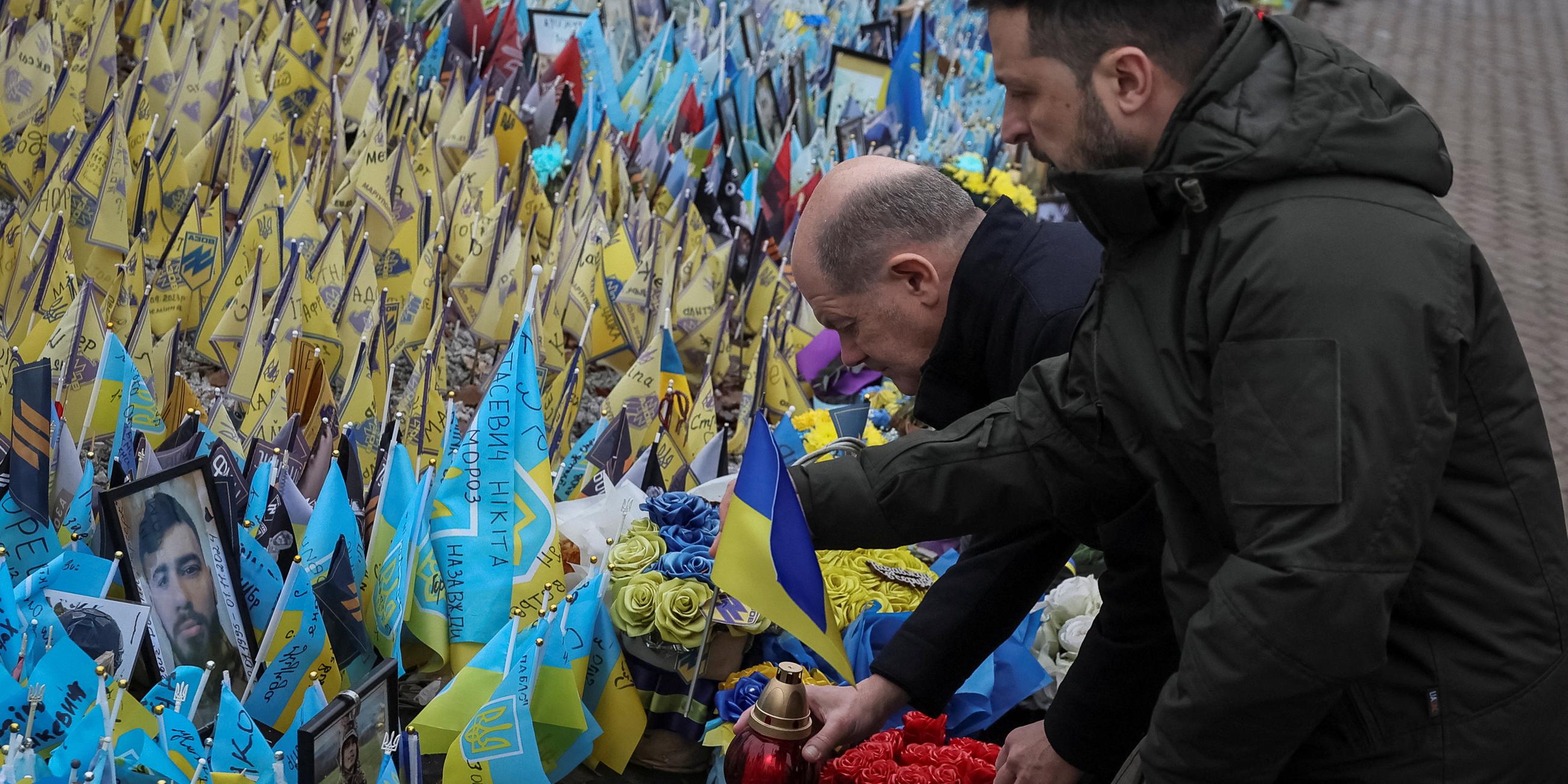 Ukraine's President Zelenskiy and German Chancellor Scholz visit makeshift memorial in Kyiv