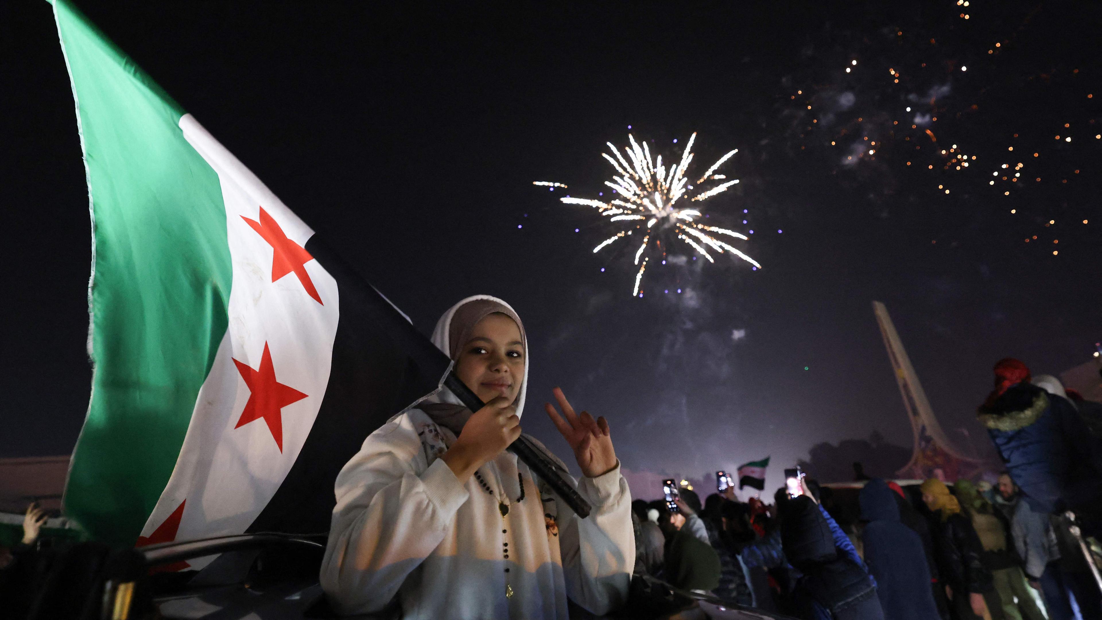 Syrians welcome first new year after fall of Assad