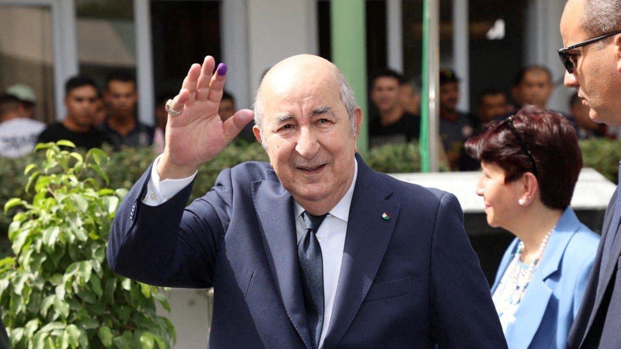 Algerian President and presidential candidate Abdelmadjid Tebboune gestures outside a polling station, during the presidential election in Algiers, Algeria September 7, 2024. 