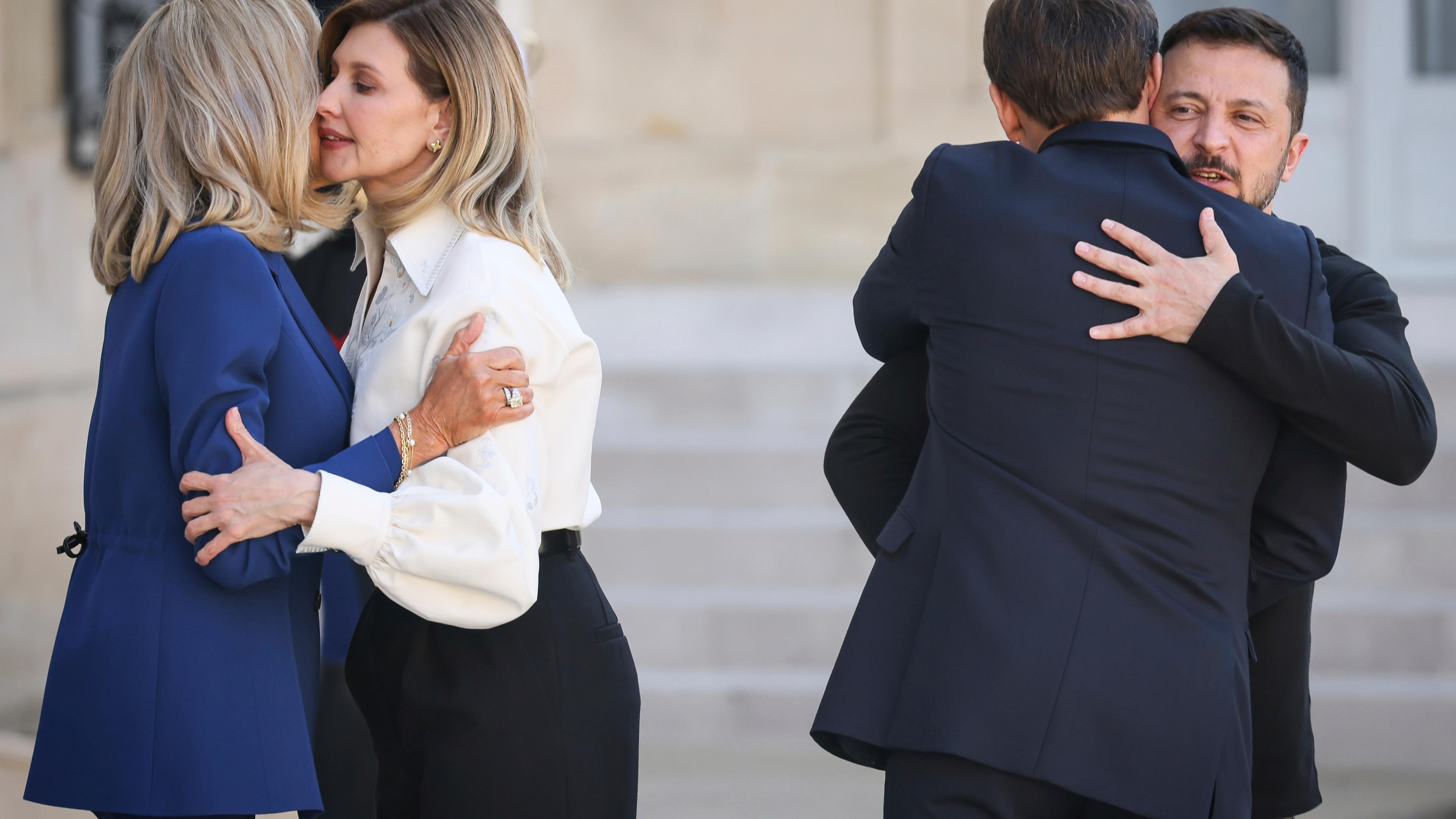 Ukrainian President Volodymyr Zelenskyy, right, and his wife Olena Zelenska, third right, are welcomed by French President Emmanuel Macron and his wife Brigitte Macron, Friday, June 7, 2024 at the Elysee Palace in Paris.