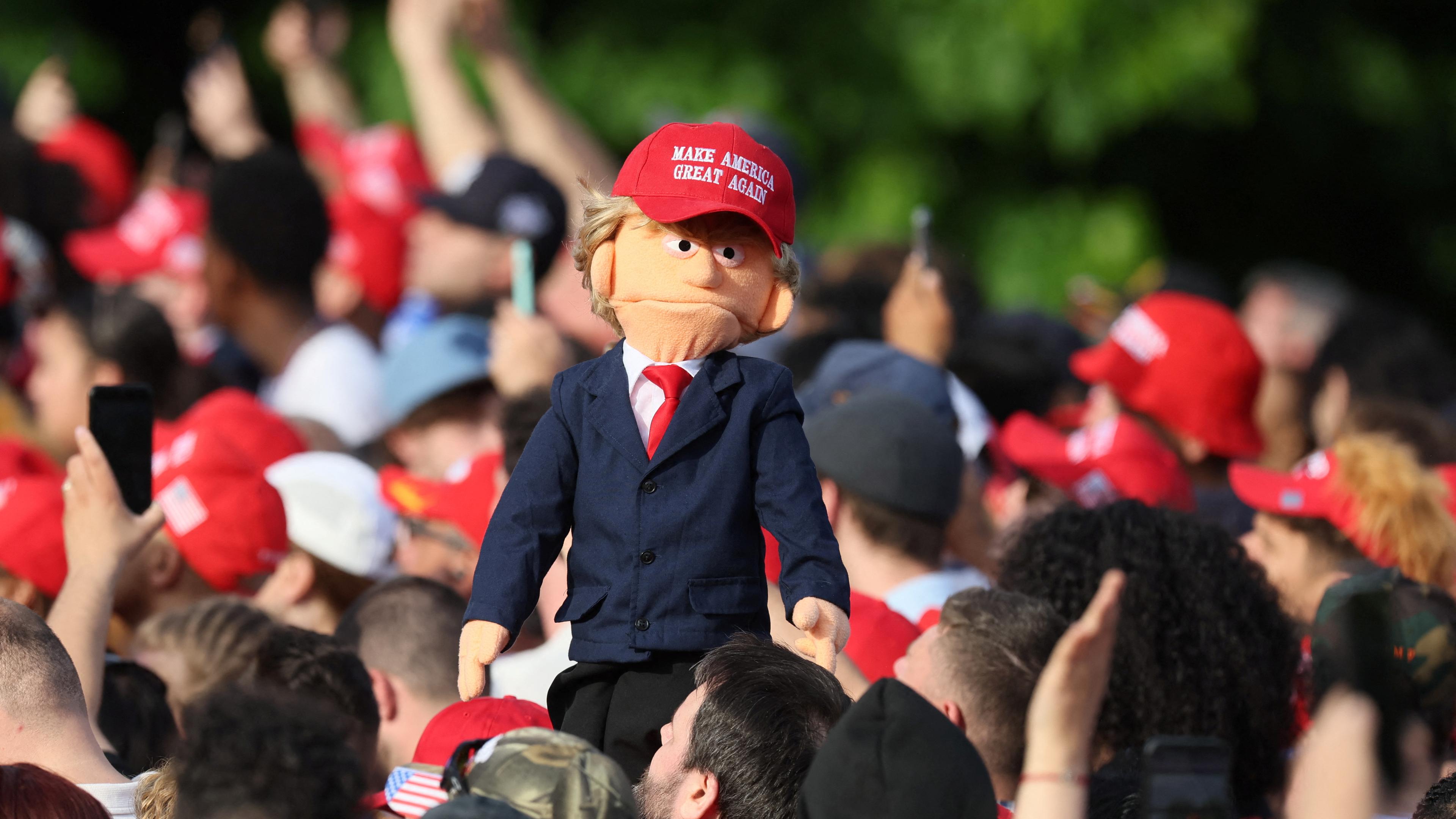 A puppet depicting former U.S. President and Republican presidential candidate Donald Trump is displayed at a campaign rally, at Crotona Park in the Bronx borough of New York City, U.S., May 23, 2024. 