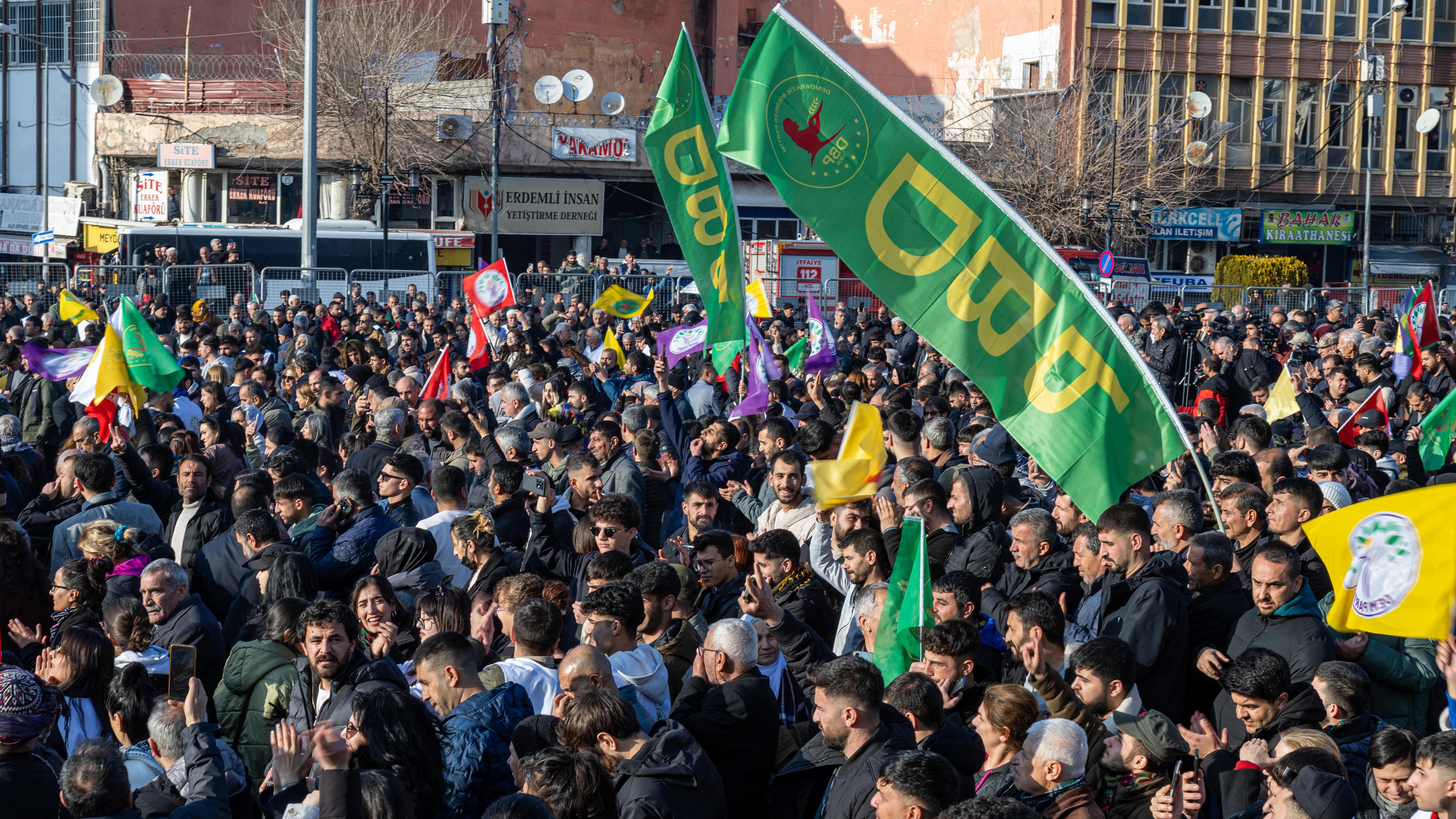 Supporters of Turkish pro-Kurdish Peoples' Equality and Democracy Party (DEM) gather to watch on a screen a press conference of a DEM delegation following their visit to jailed Kurdistan Workers' Party (PKK) leader Abdullah Ocalan, in Diyarbakir, Turkey, 27 February 2025. 