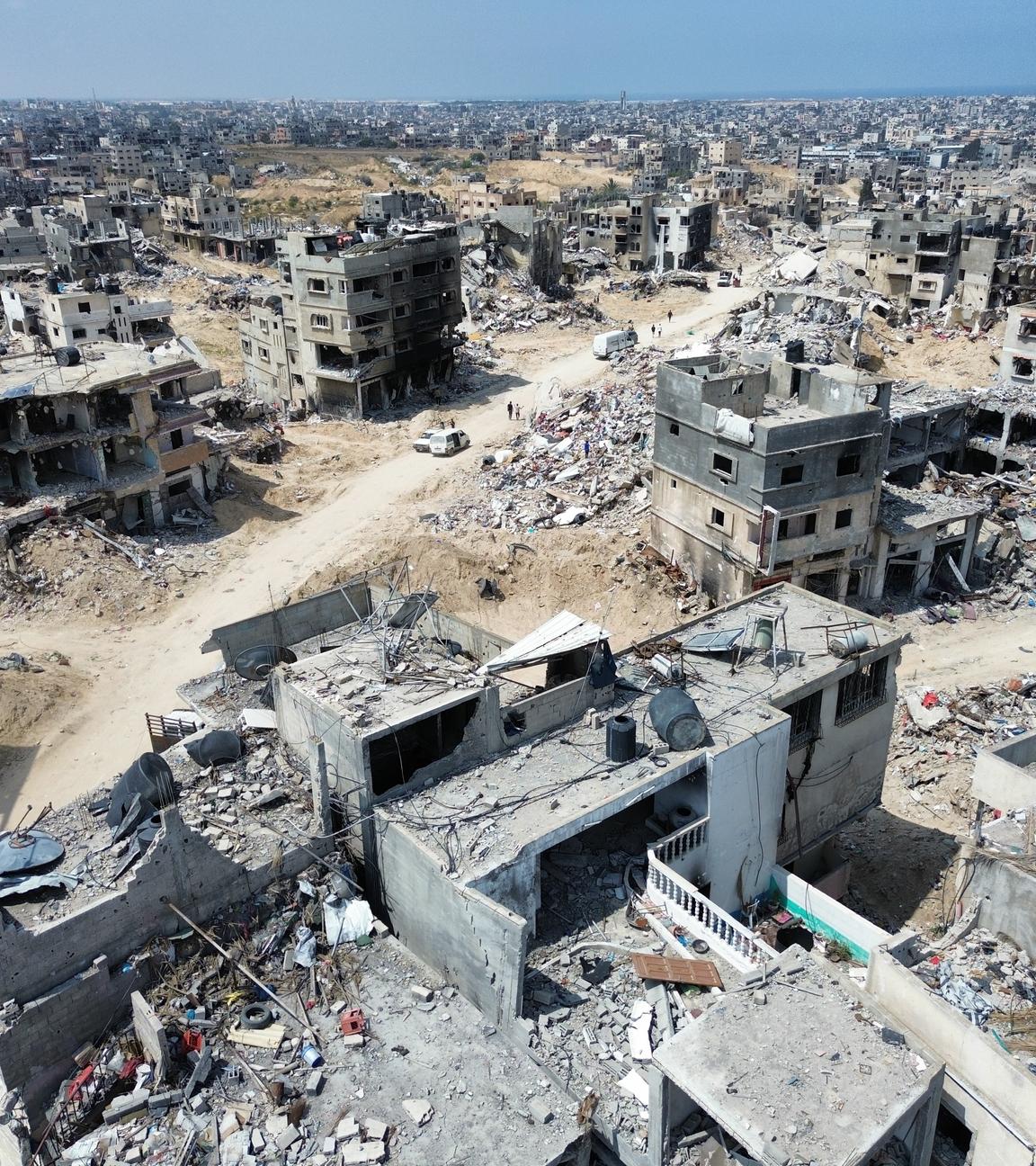 Aerial view taken with a drone showing general destruction in the city of Khan Yunis in the Gaza Strip, following the Israeli army withdrawal from the region, on 14 April 2024. 