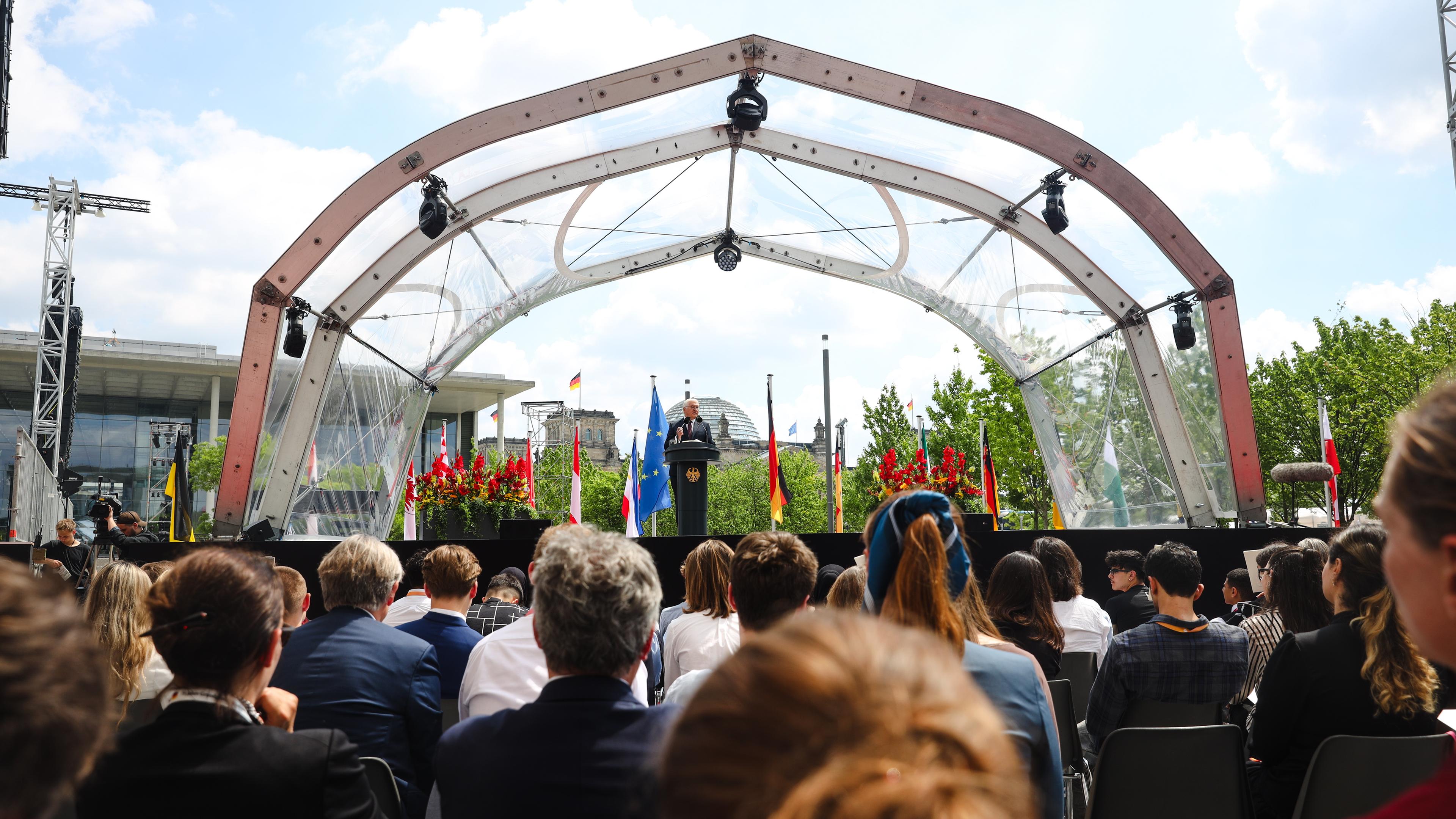 German President Frank-Walter Steinmeier (C) speaks during a state act to mark the 75th anniversary of the German Basic Law (Grundgesetz) in Berlin,