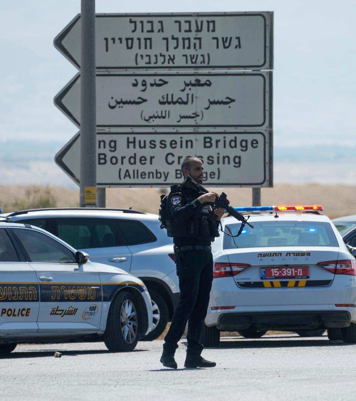 Israeli police stand guard near the site of a deadly shooting attack where Israeli officials say three people were shot and killed at the Allenby Bridge Crossing between the West Bank and Jordan, Sunday, Sept. 8, 2024.