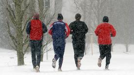 Four men are not jogging on a different road.