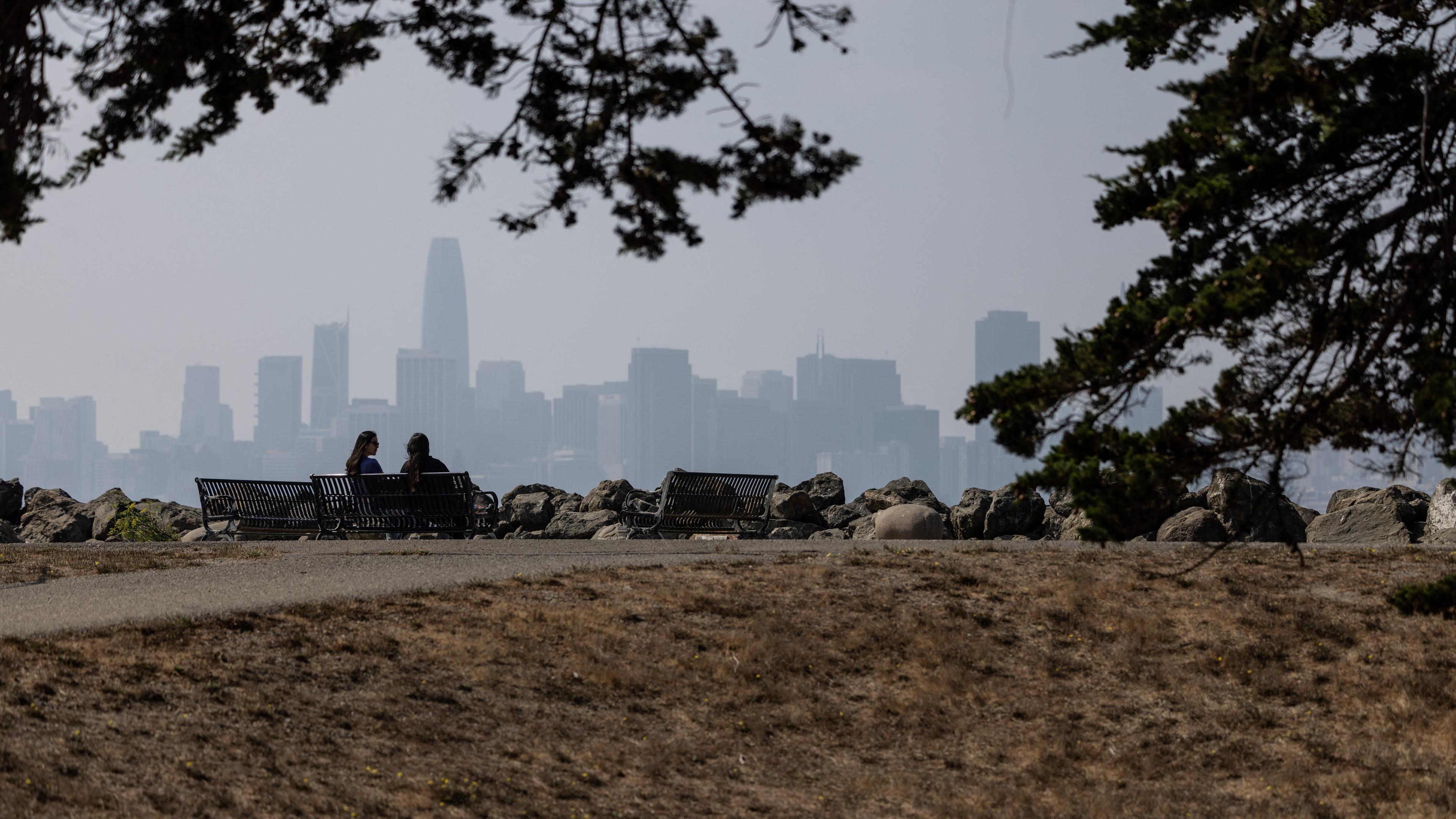 People looks at the city of San Francisco skyline covered by smoke from wildfire in northern California, in San Francisco, California, U.S., September 20, 2023.