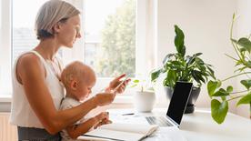 Mother with child on laptop