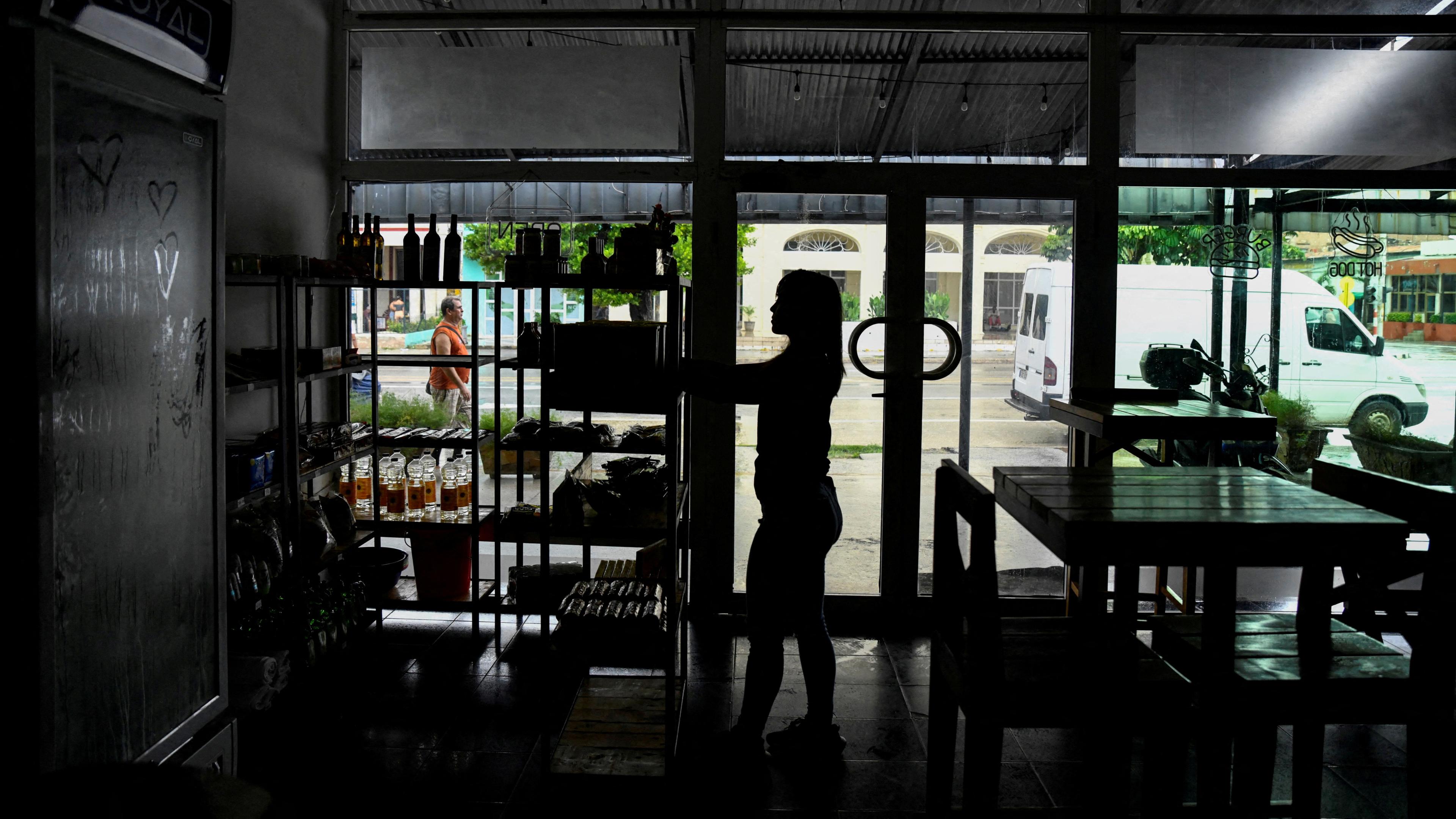  A woman works in a restaurant during a blackout in Havana, Cuba,