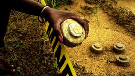 A female hand, with a landmine.