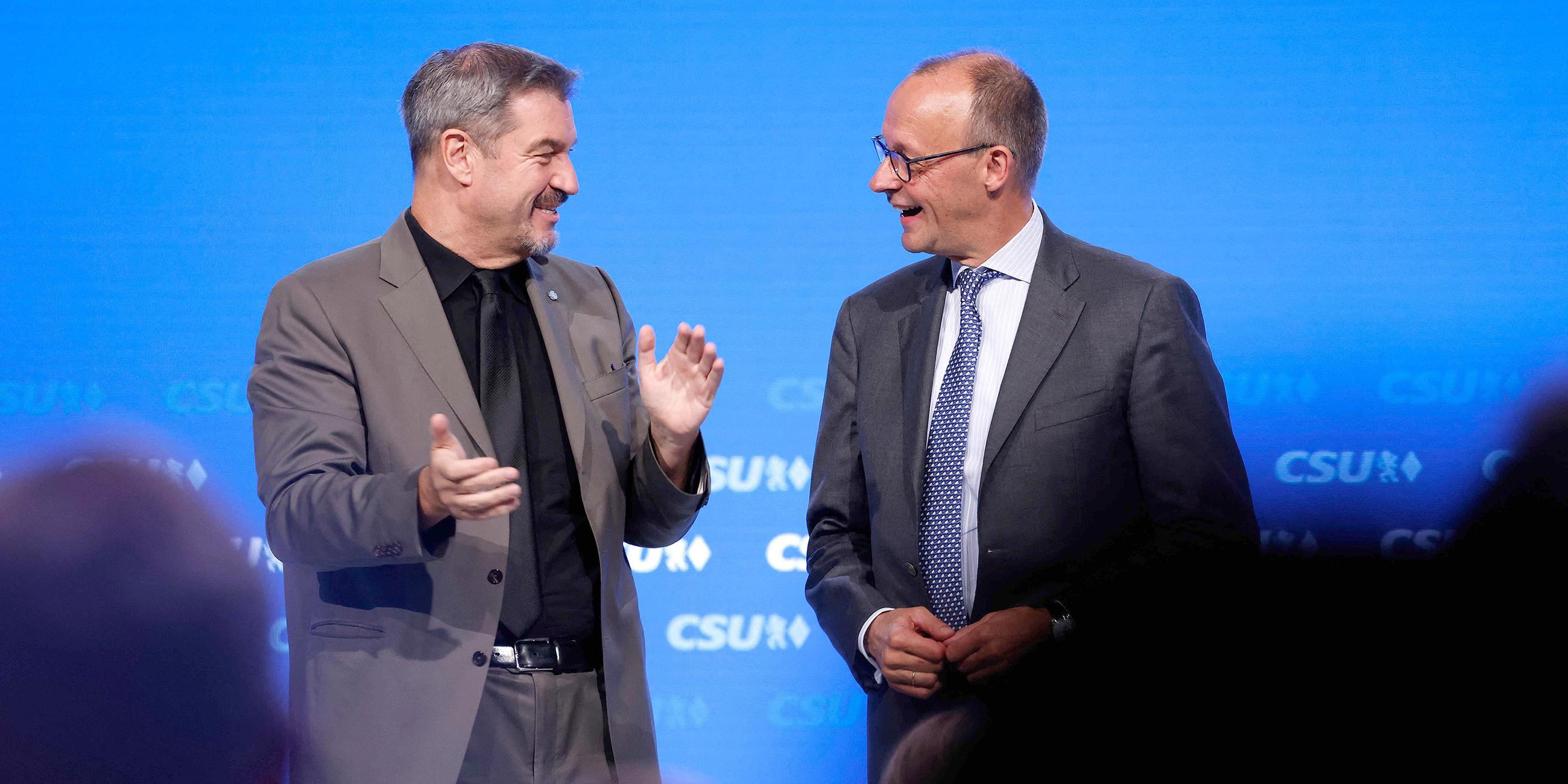 Markus Söder und Friedrich Merz (r)