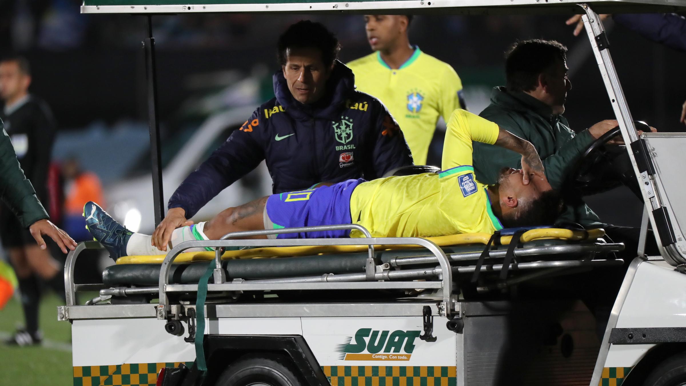 Neymar is transported from the pitch after his injury