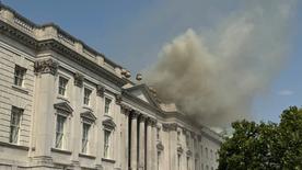 Rauch steps out of the roof of Somerset House in the centre of London.