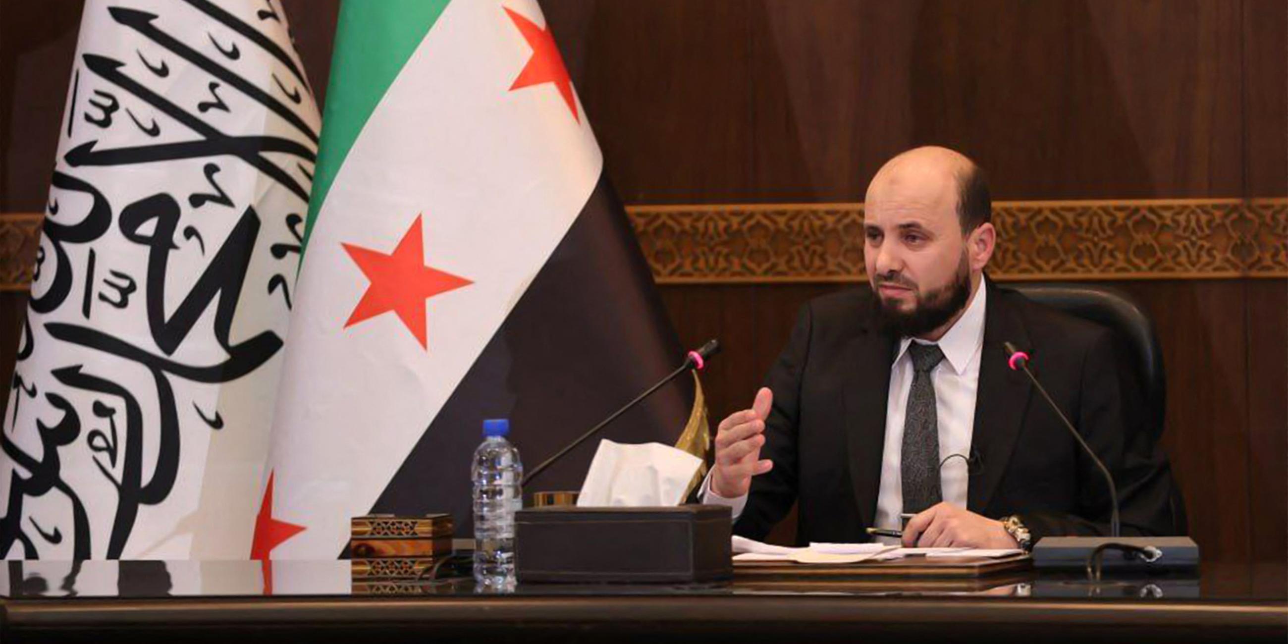 This handout image made available by the Telegram channel of the official Syrian Arab News Agency (SANA) shows Syria's new transitional prime minister Mohammad al-Bashir chairing a meeting of the new cabinet in Damascus on December 10, 2024.