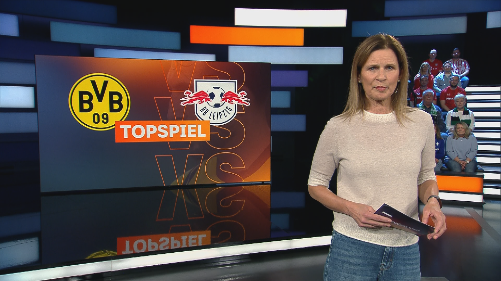 Katrin Müller-Hohenstein mit Topspiel-Logo.