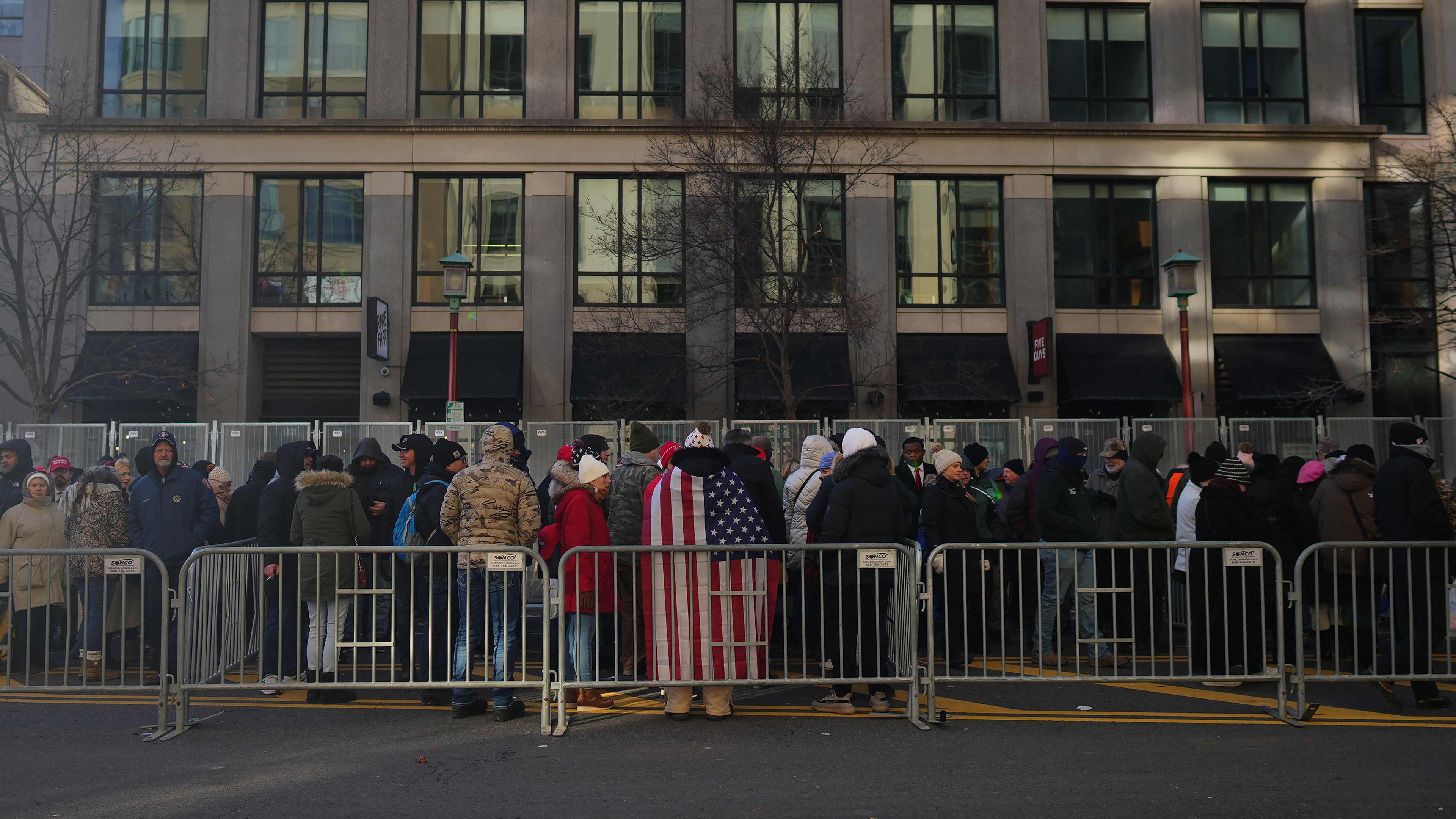 Supporters wait outside Capital One Arena ahead of the inauguration of U.S. President-elect Donald Trump 