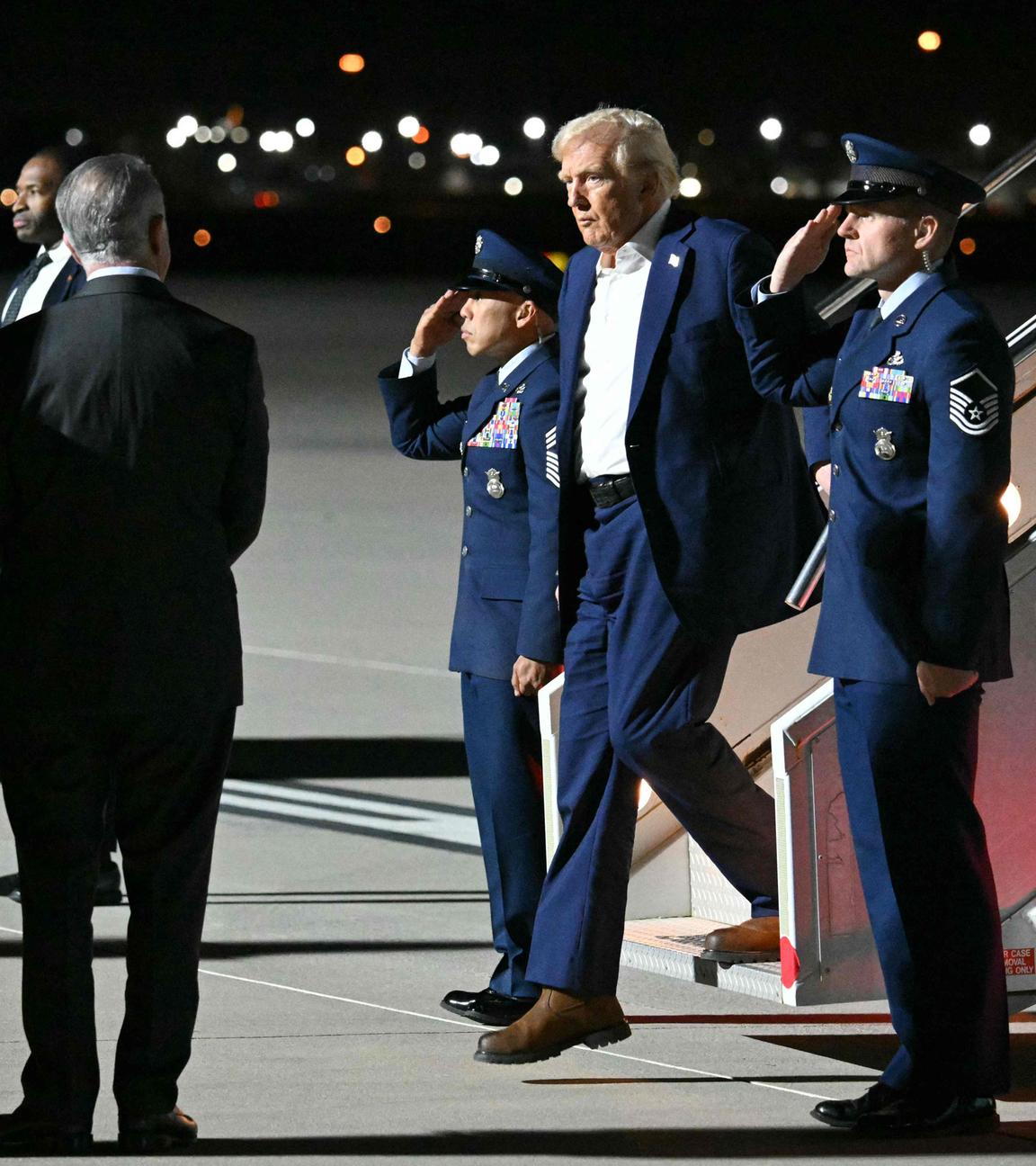 US President Donald Trump steps off Air Force One upon arrival at Harry Reid International Airport in Las Vegas.