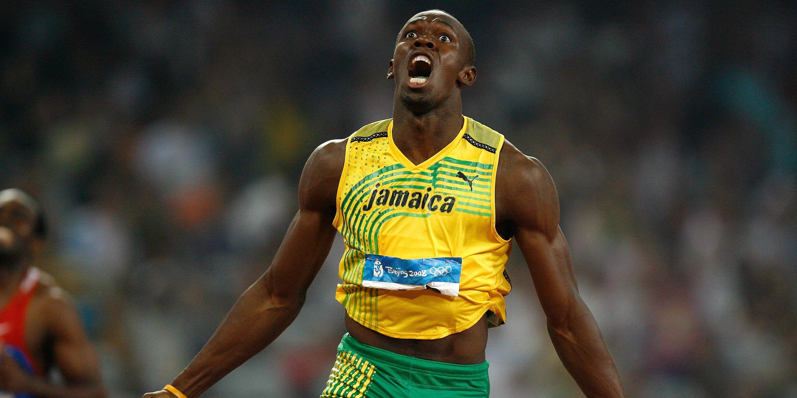 Olympiasieger Usain Bolt (Jamaika) läuft ins Ziel mit neuem Weltrekord.