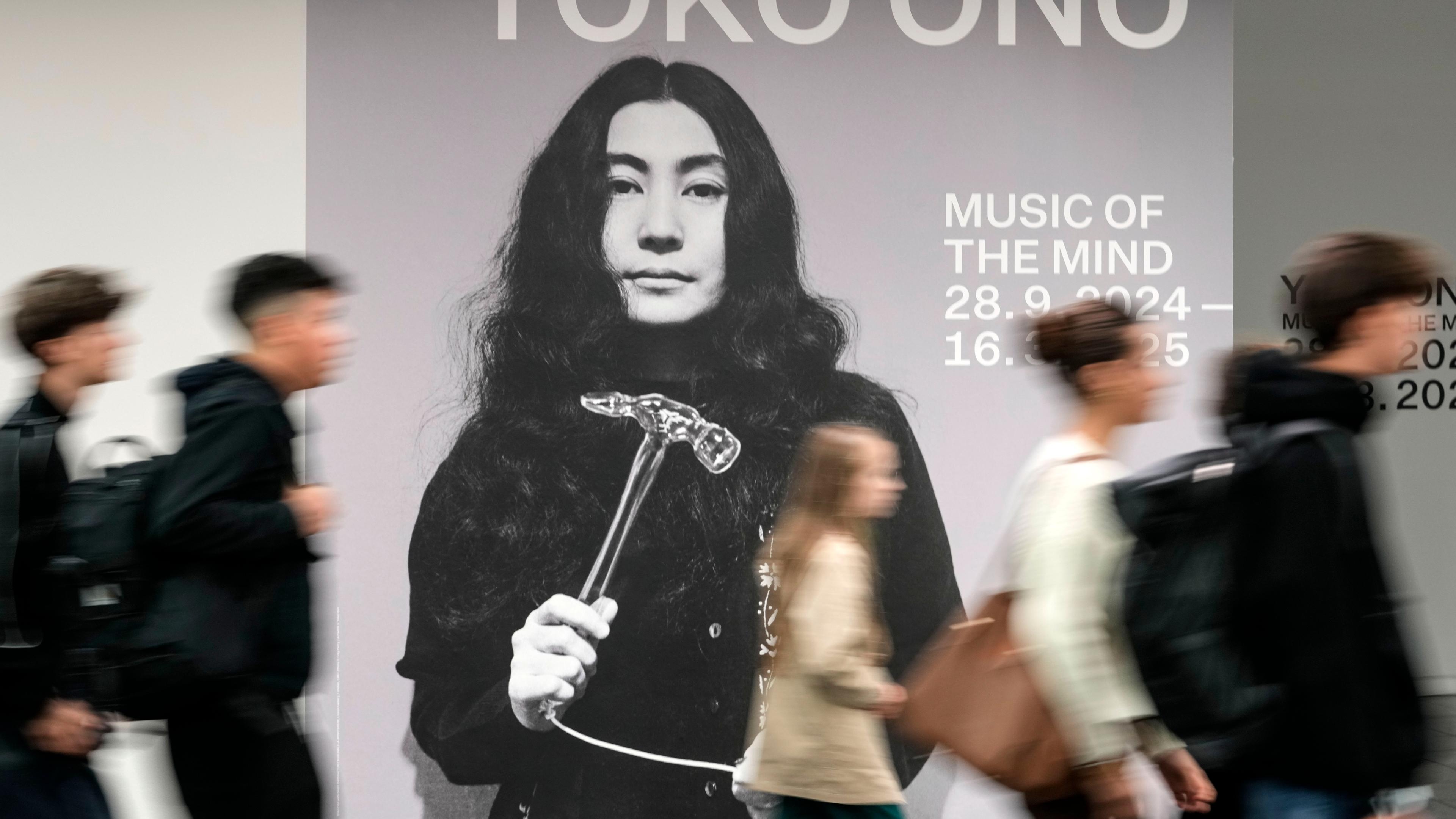 Young people enter the preview of the compre-hensive solo exhibition "MUSIC OF THE MIND" of artist and activist Yoko Ono